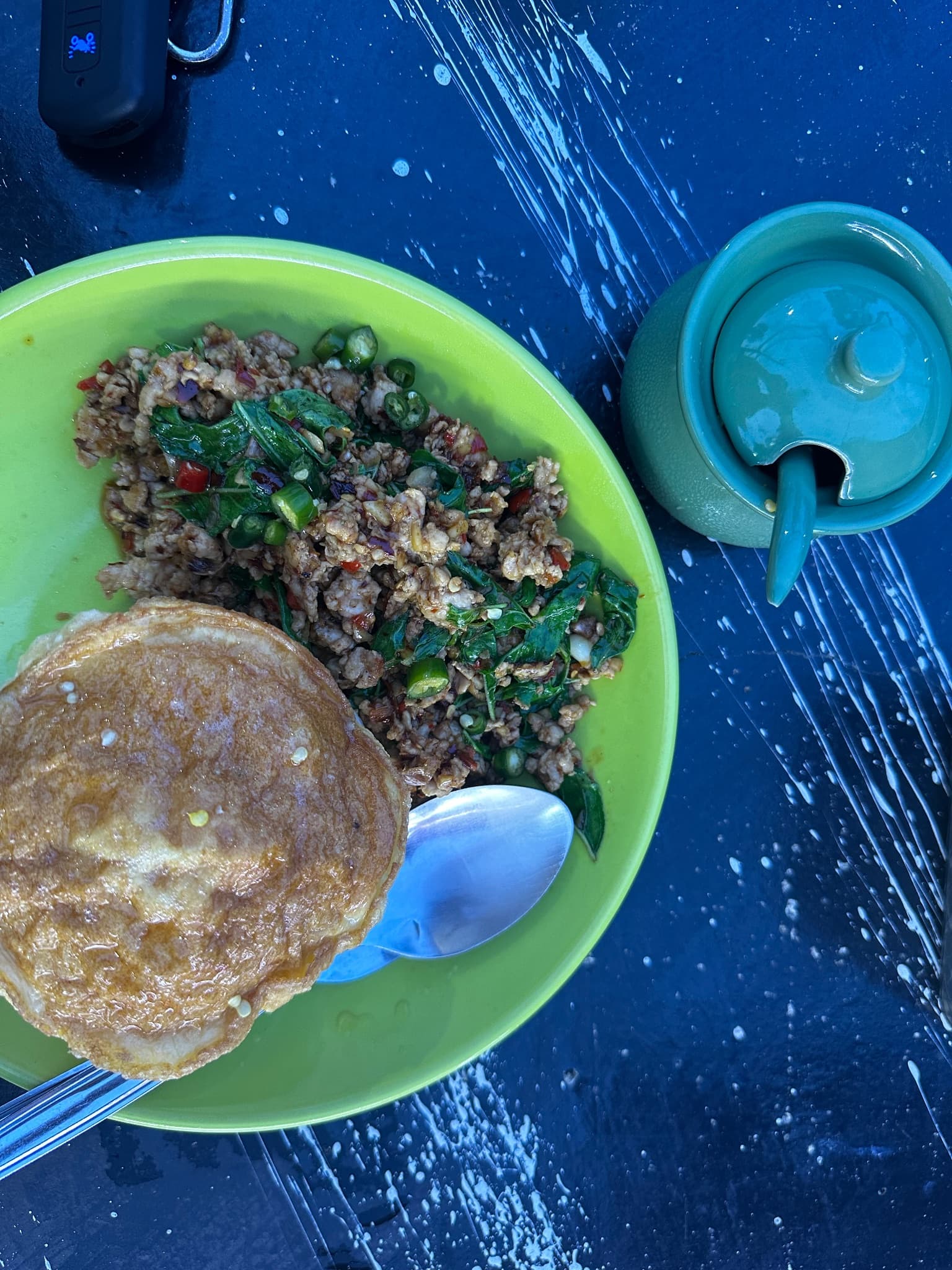 a plate of khao pad kra pao