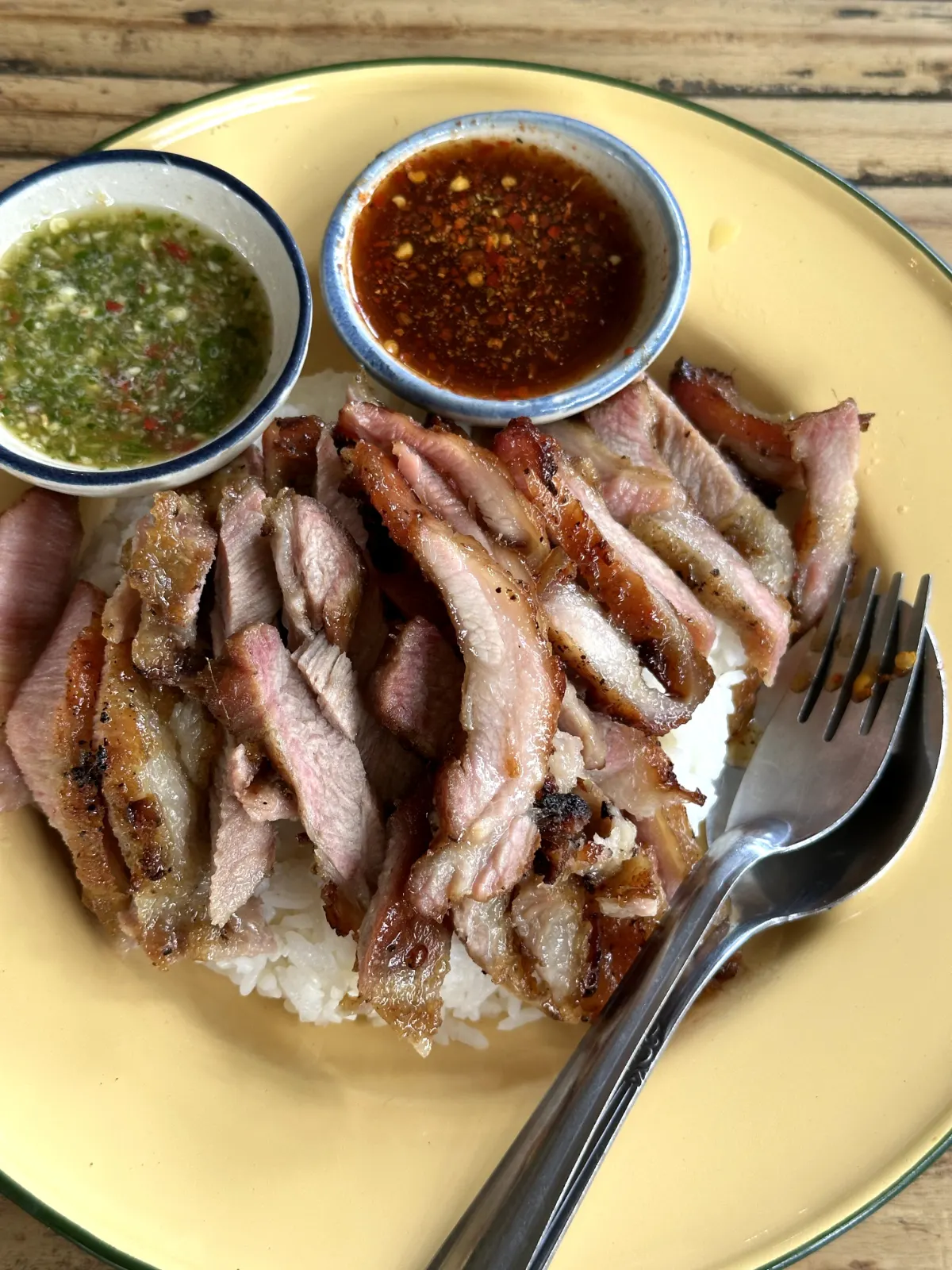 a plate of grilled pork neck