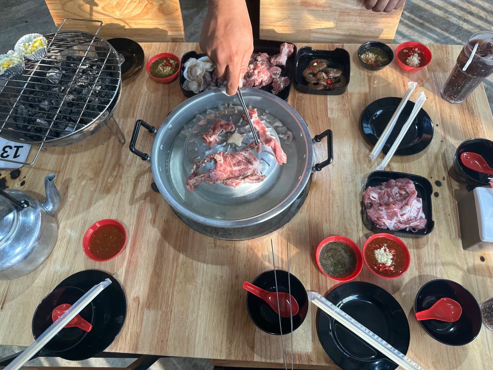 moo kratha grill on a small table