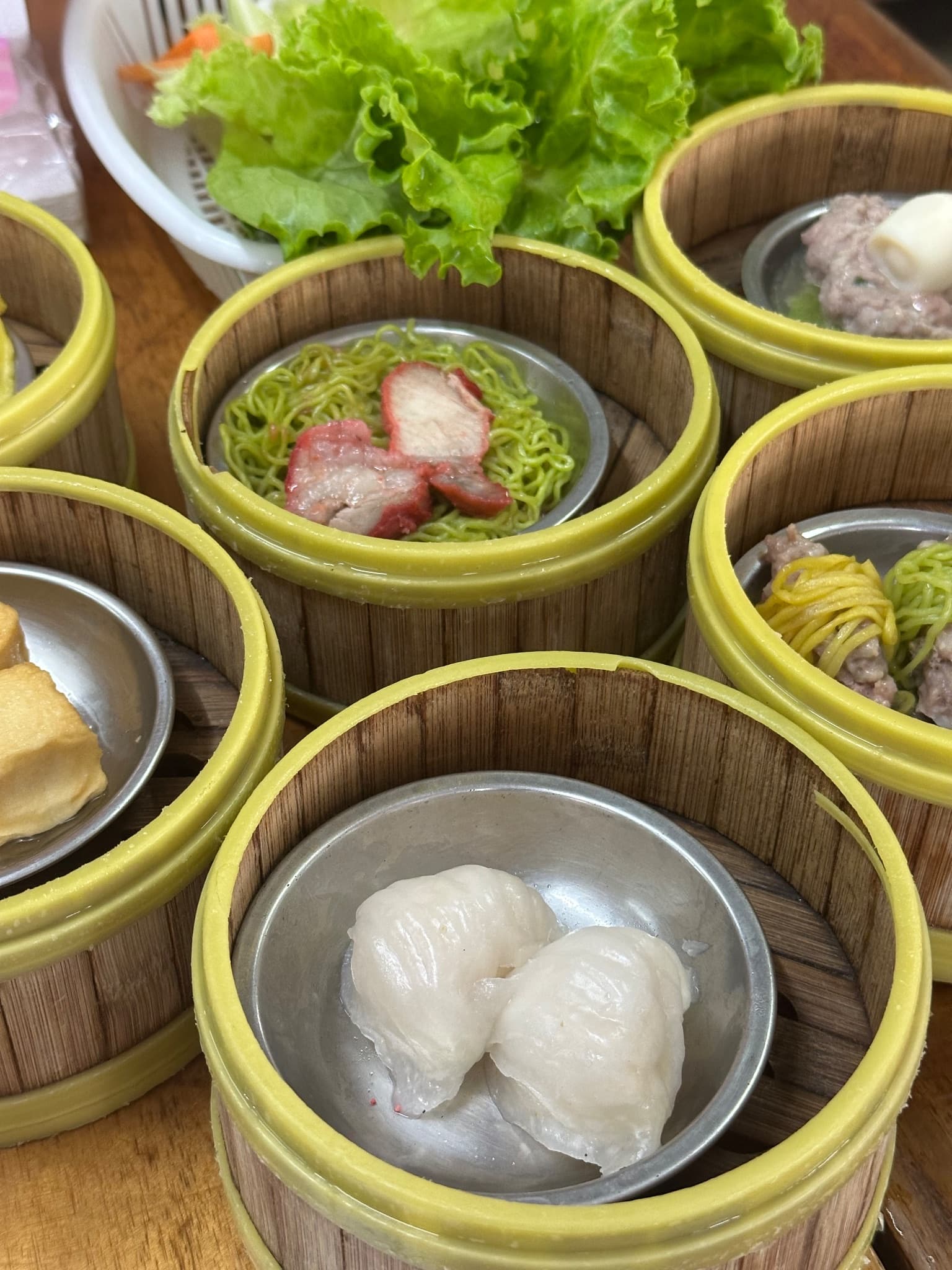 Plates of dim sum pieces